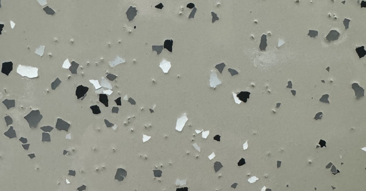 close up of a full flake epoxy floor with black and grey - Innovative Garage Flooring epoxy flooring