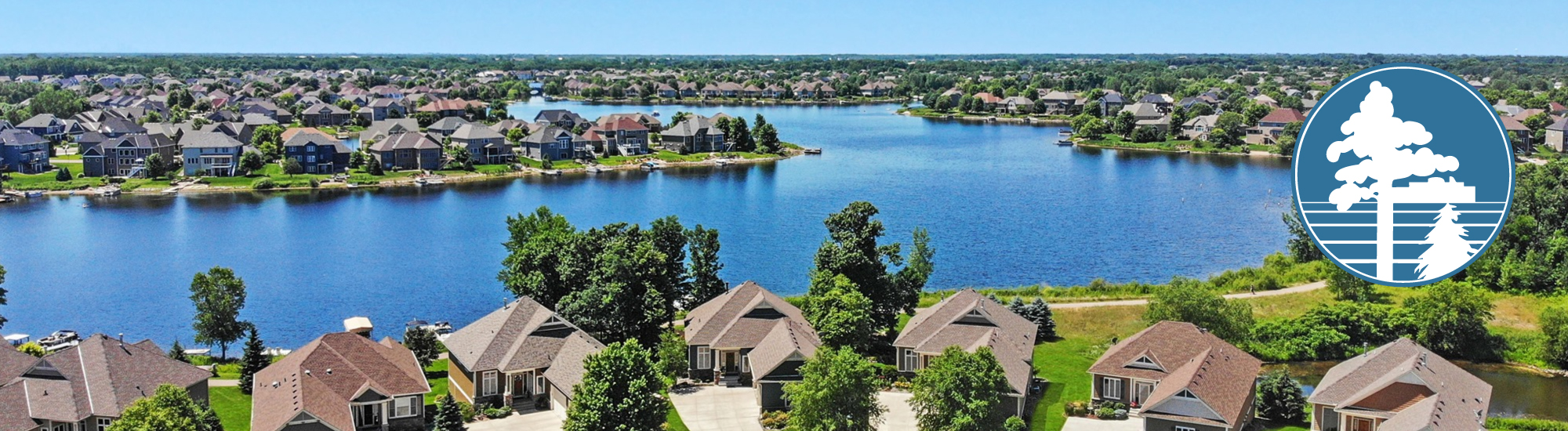 aerial view of a pond with houses surrounding it - Innovative Garage Flooring Blaine epoxy flooring