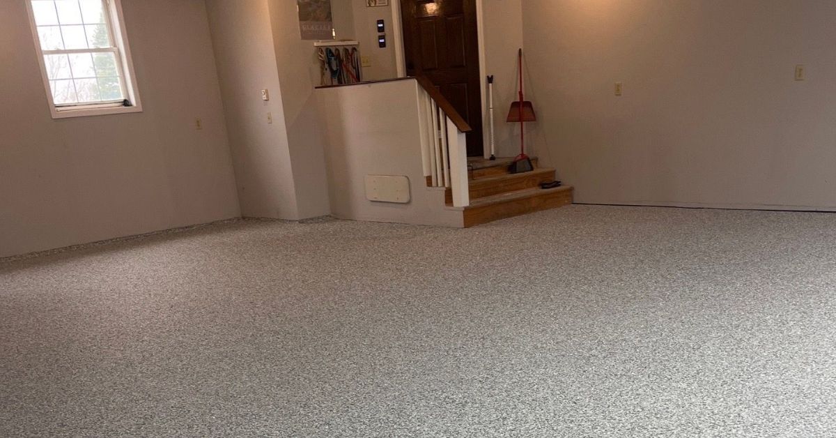 epoxy flooring with a grey base and white flakes - Innovative Garage Flooring epoxy flooring contractor near