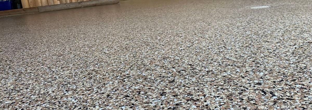 epoxy flooring with a grey base and white flakes - Innovative Garage Flooring epoxy flooring contractor near