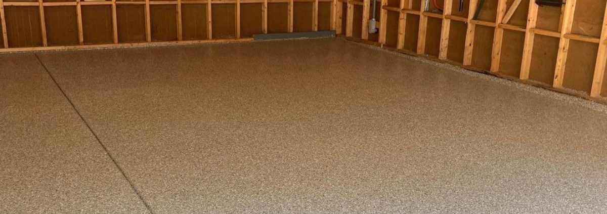 epoxy floor in a garage with wood stud walls - Innovative Garage Flooring residential epoxy flooring