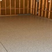 epoxy floor in a garage with wood stud walls - Innovative Garage Flooring residential epoxy flooring