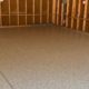 epoxy floor in a garage with wood stud walls - Innovative Garage Flooring residential epoxy flooring