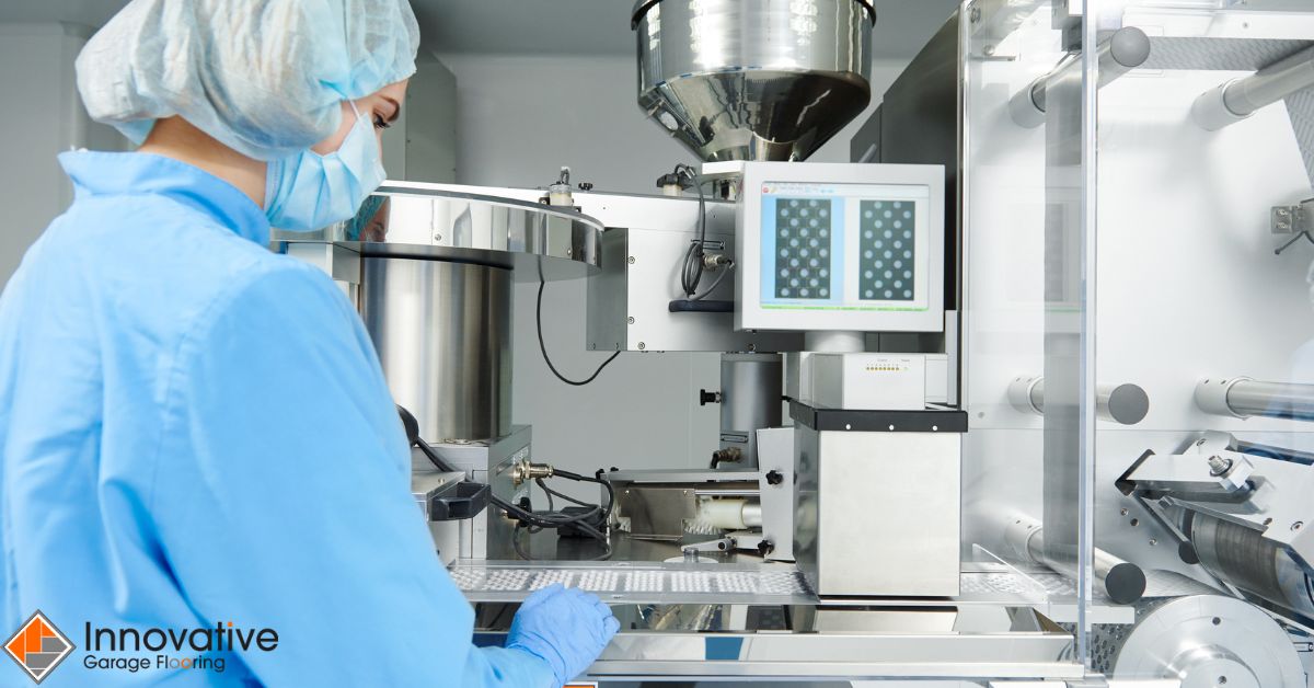 factory worker pressing buttons for pharmacy machine - Innovative Garage Flooring industrial epoxy flooring