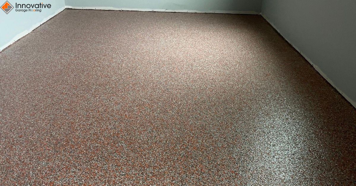 close up of full flake epoxy flooring with orange and grey flakes - Innovative Garage Flooring epoxy flooring contractors near