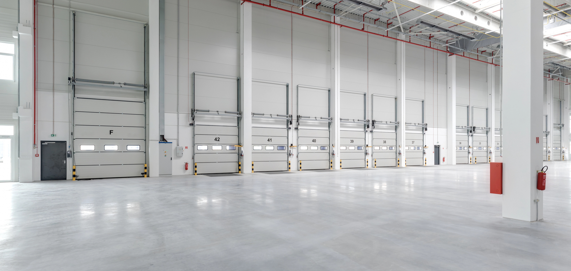 industrial facility with multiple closed garage doors - Innovative Garage Flooring commercial flooring