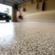 close up of flake flooring with a polyaspartic coating - Innovative Garage Flooring polyaspartic floor coating